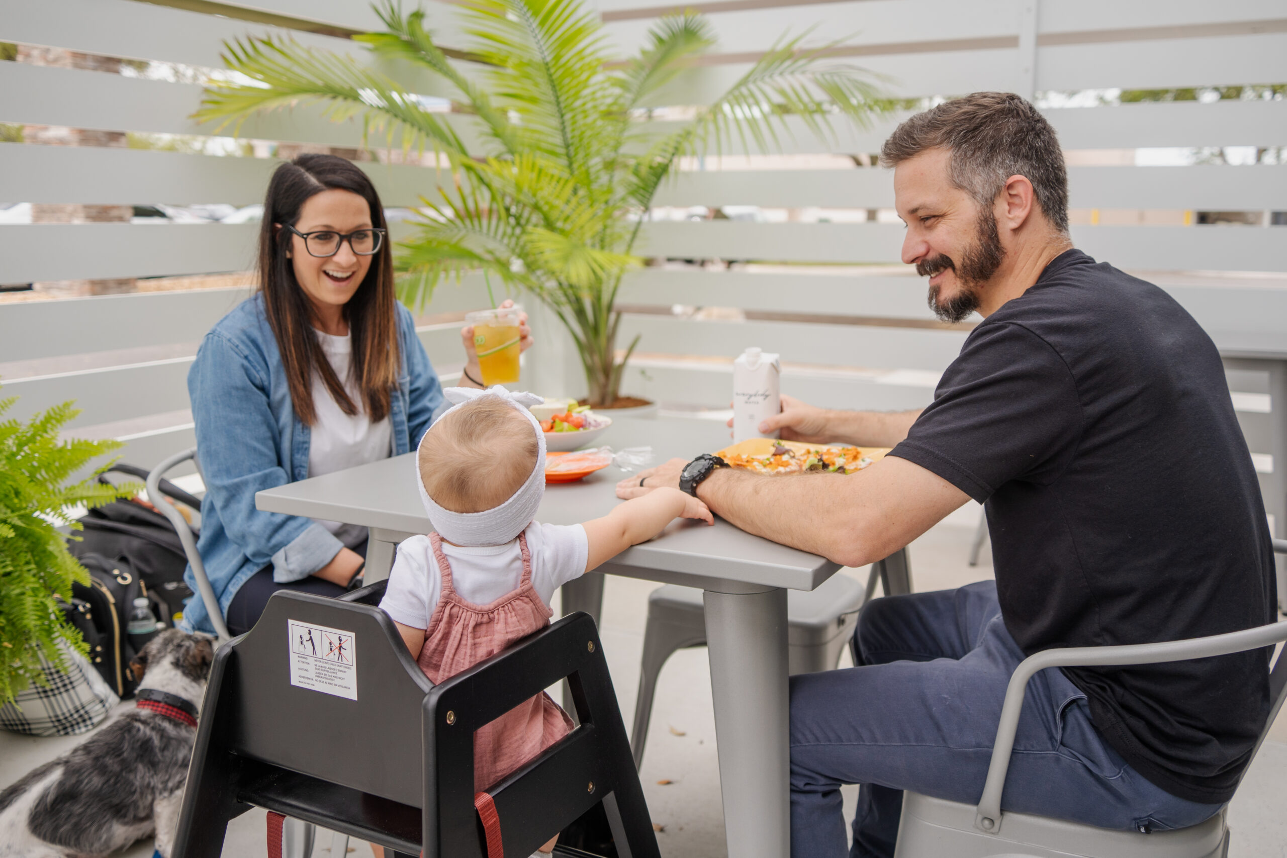 Family sitting at table enjoying food